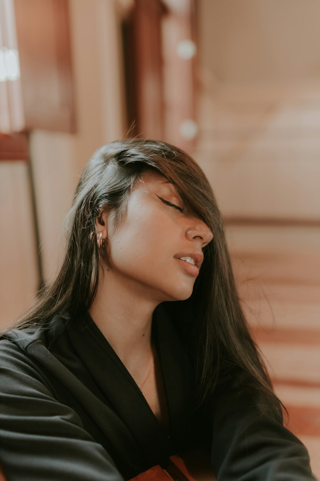 Portrait of a professional woman with dark hair in a blazer